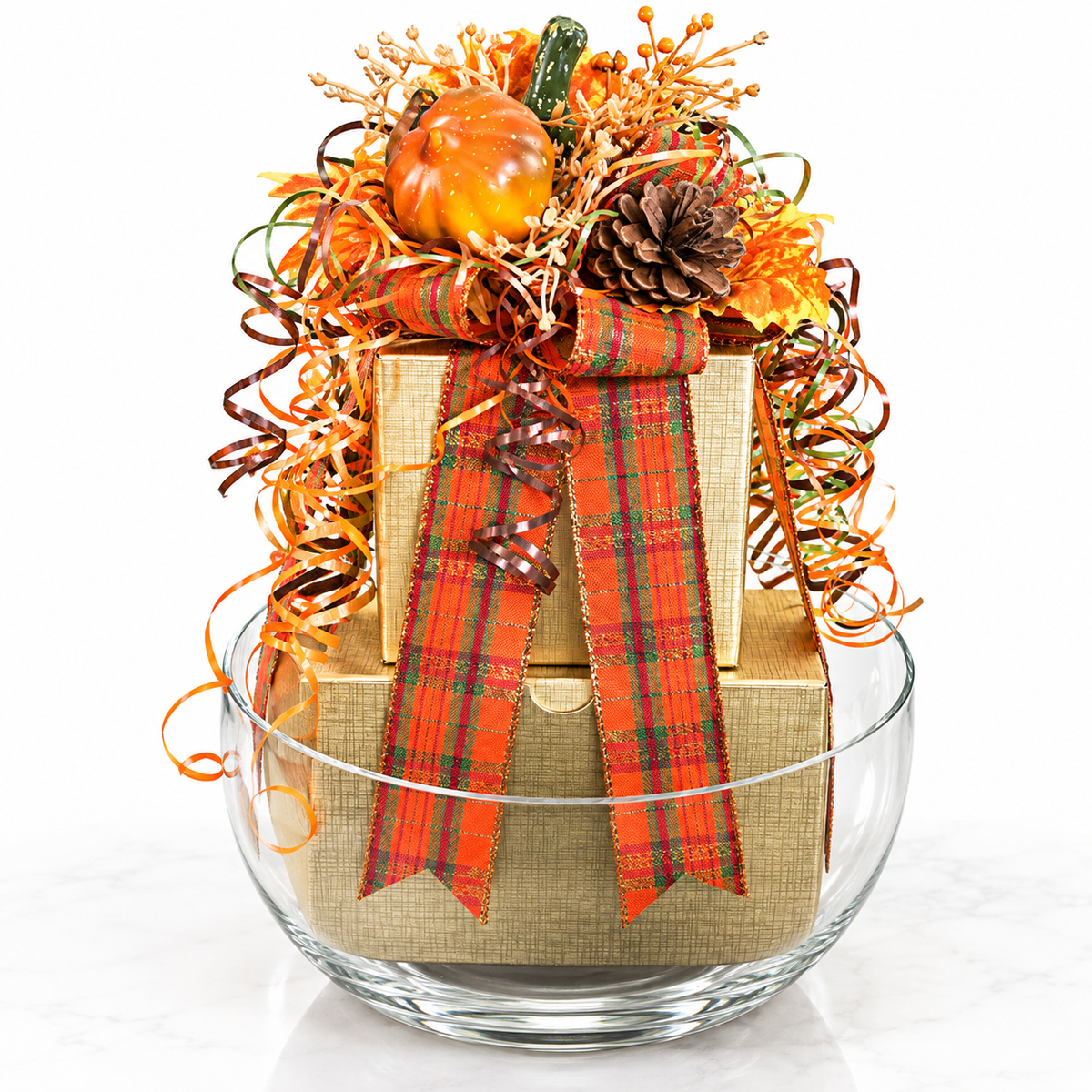 Autumn gift boxes in a glass bowl with orange plaid ribbon, pumpkins, and fall florals