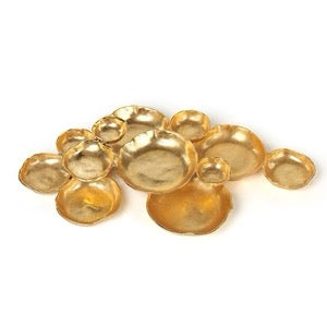 Gold cluster serving tray of joined irregular shallow bowls on white background