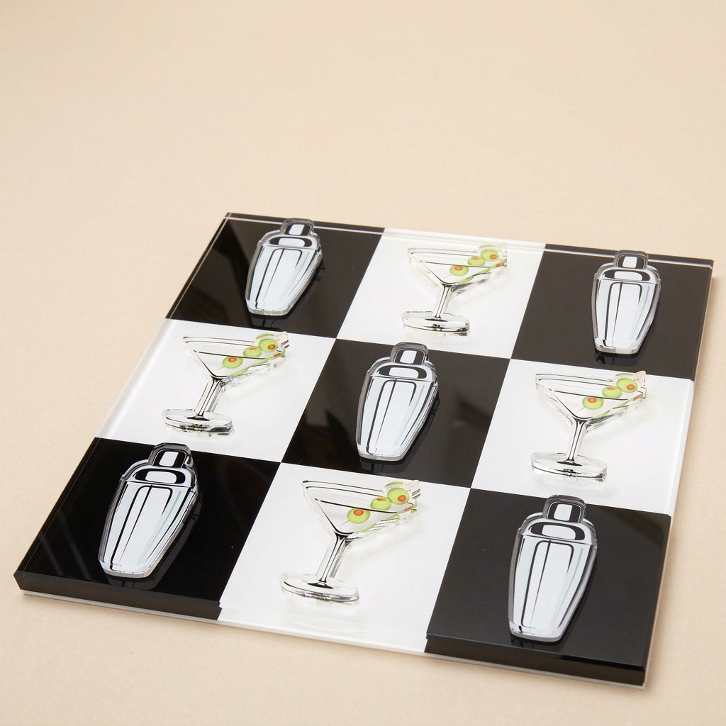 Checkered acrylic tic-tac-toe board with cocktail shaker and martini glass pieces